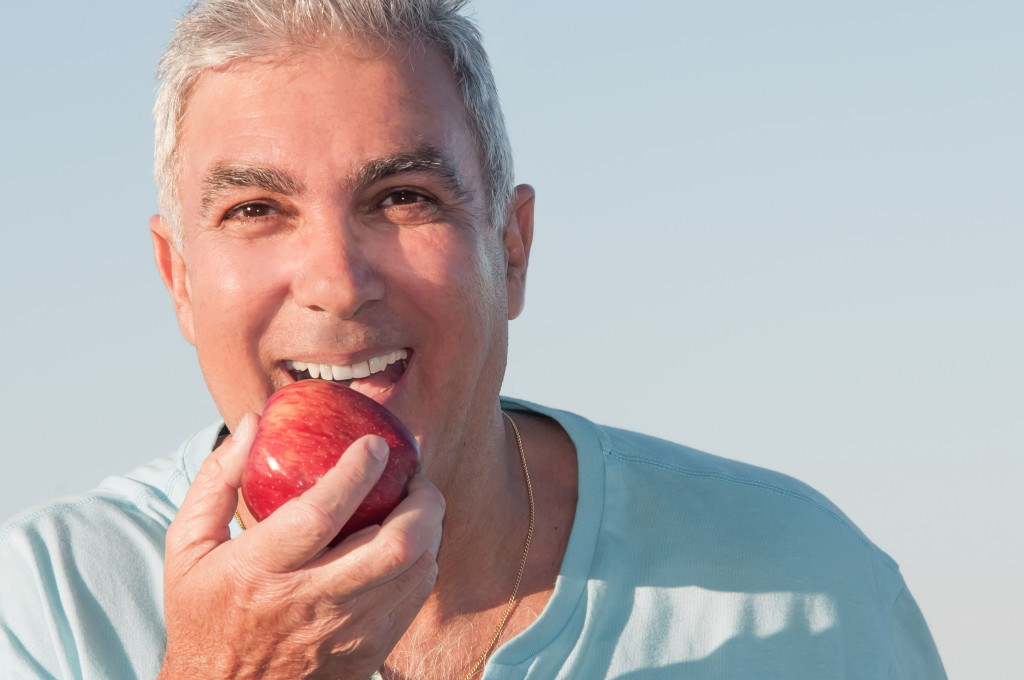 man eating an apple