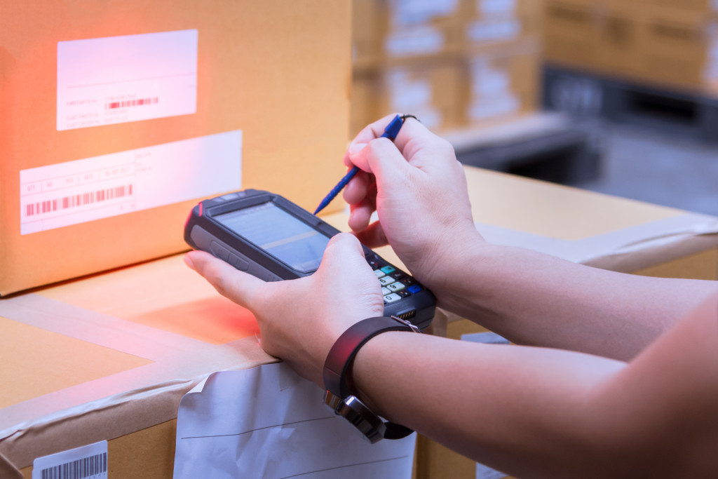 person using a technology for inventory management
