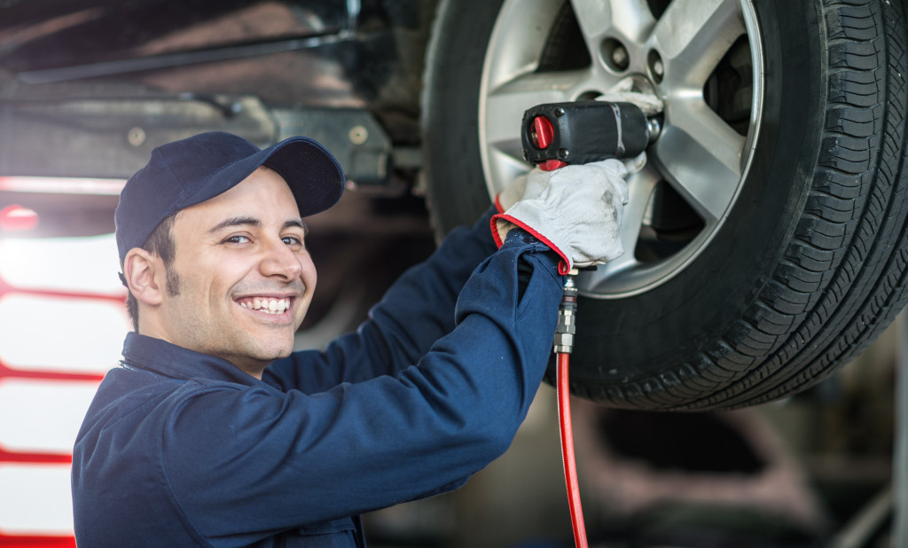 man fixing a tire