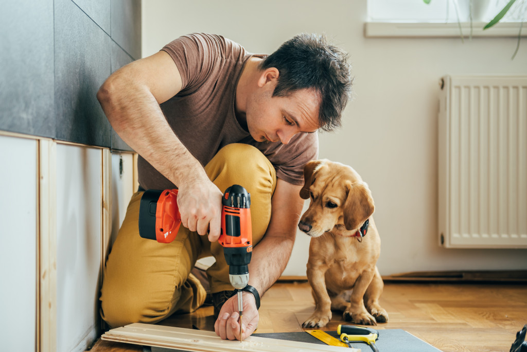 a carpenter with a dog