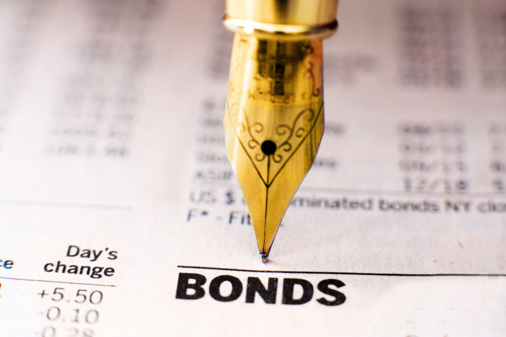 A fountain pen on a document showing bond indices