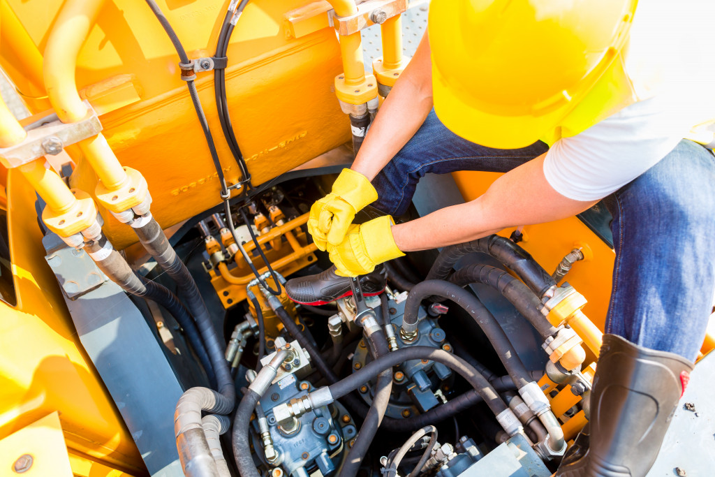 motor mechanic working on a construction truck