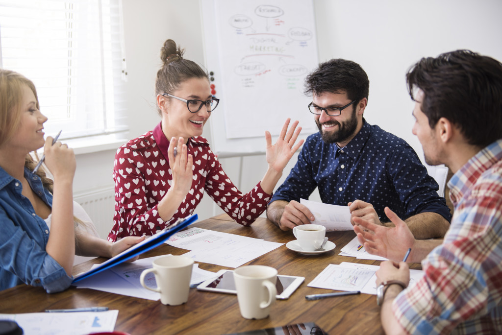 employees brainstorming during a meeting in office