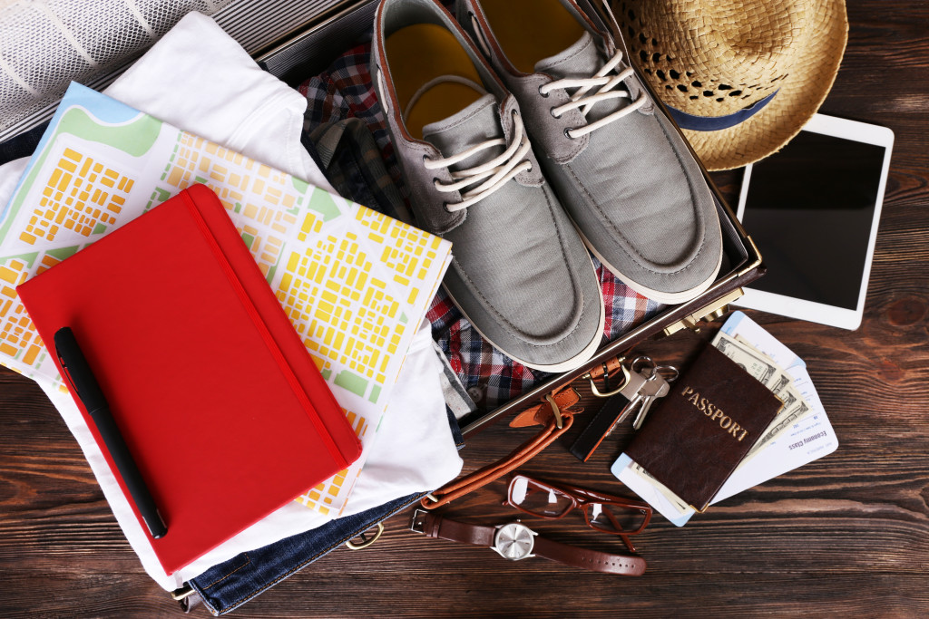 A packed suitcase with vacation items