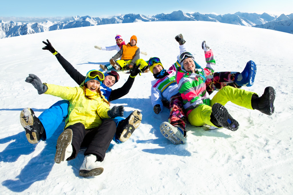 Coworkers posing on a ski slope in a resort