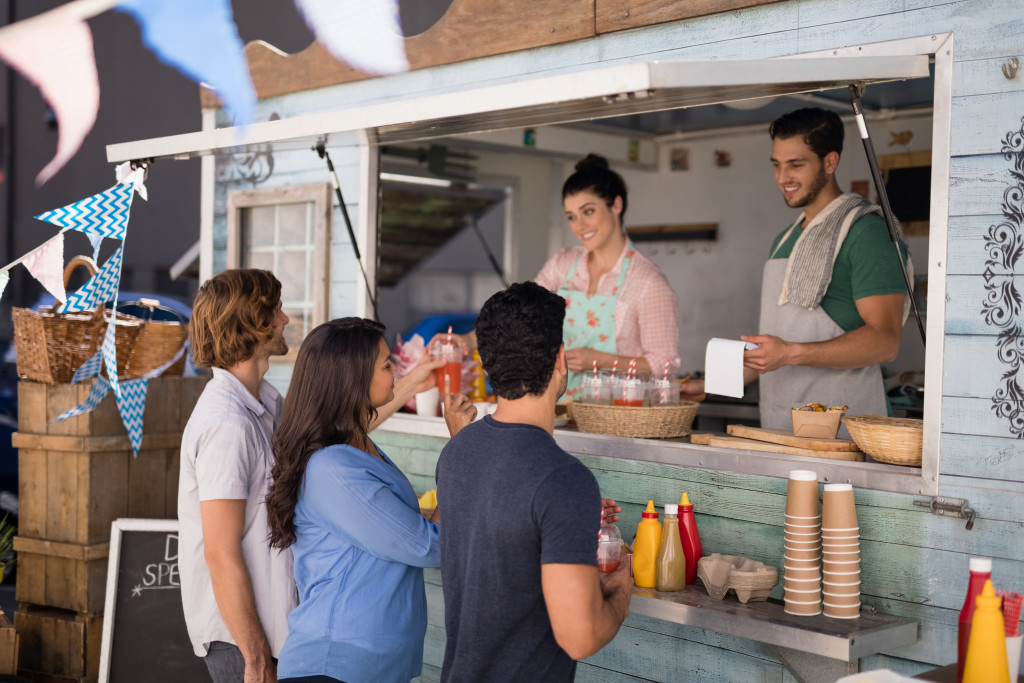 a food truck with colorful banners