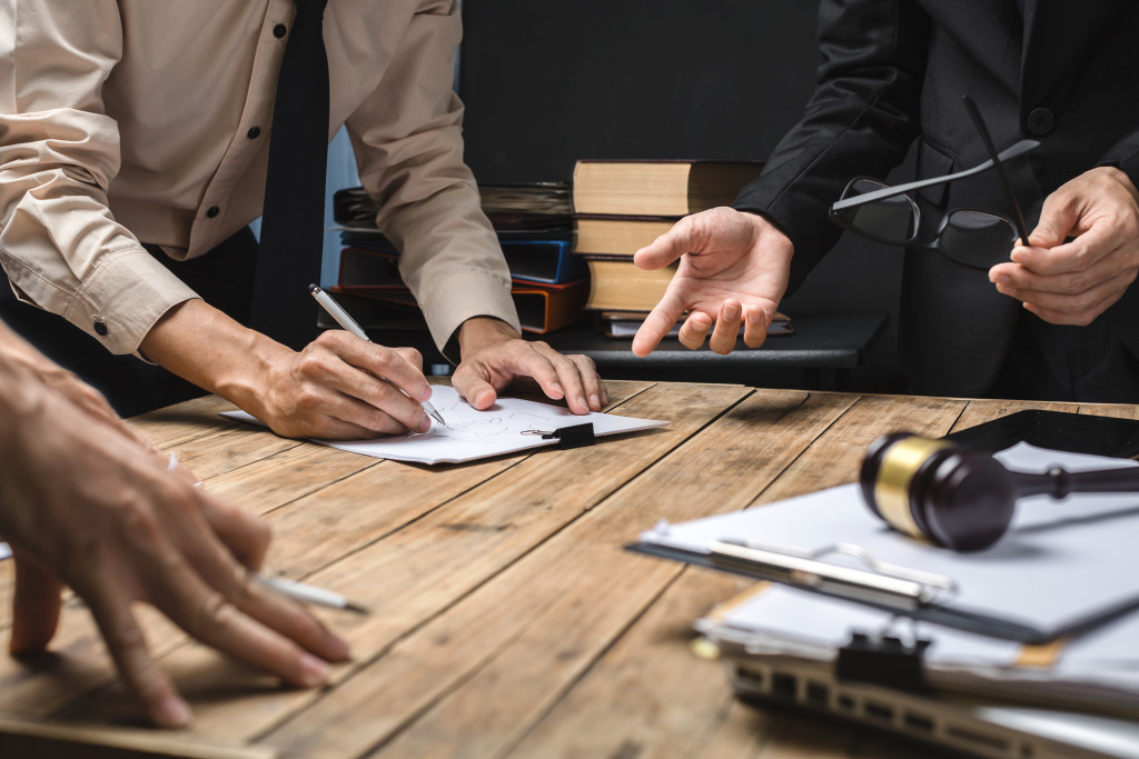 a lawyer talking to businessmen 