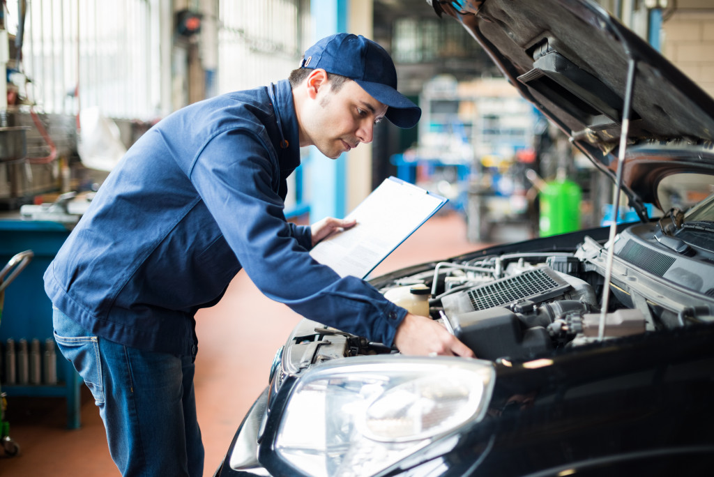 mechanic inspecting a vehicle