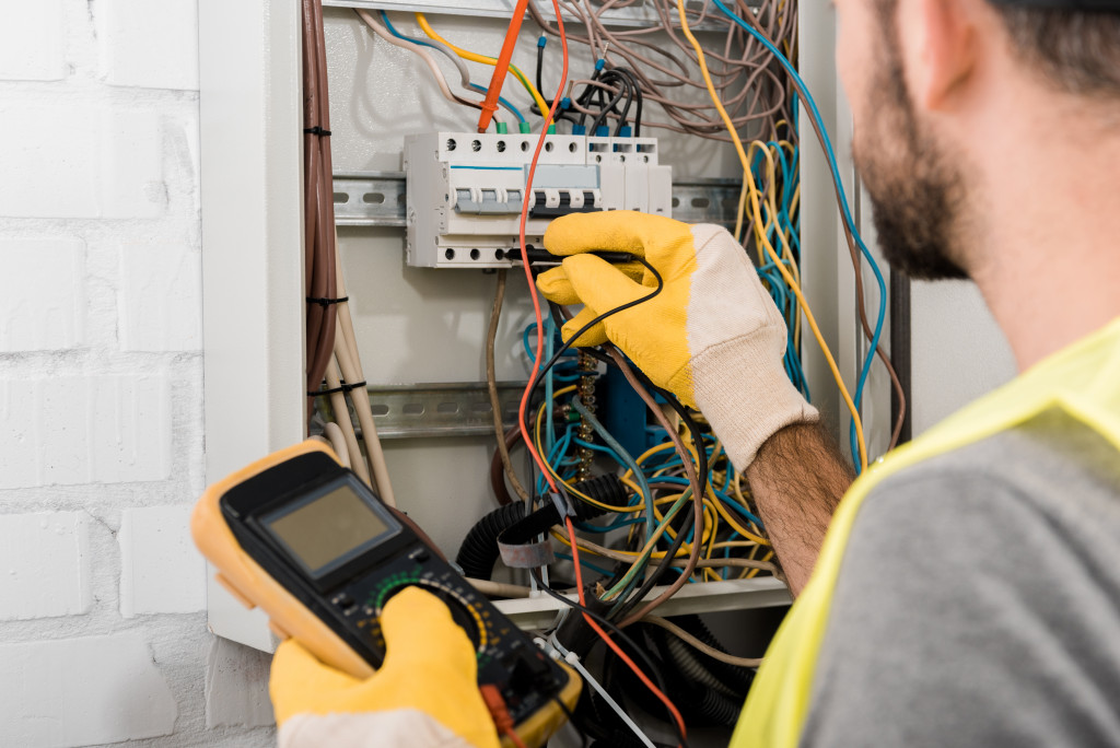 An electrician checking wirings