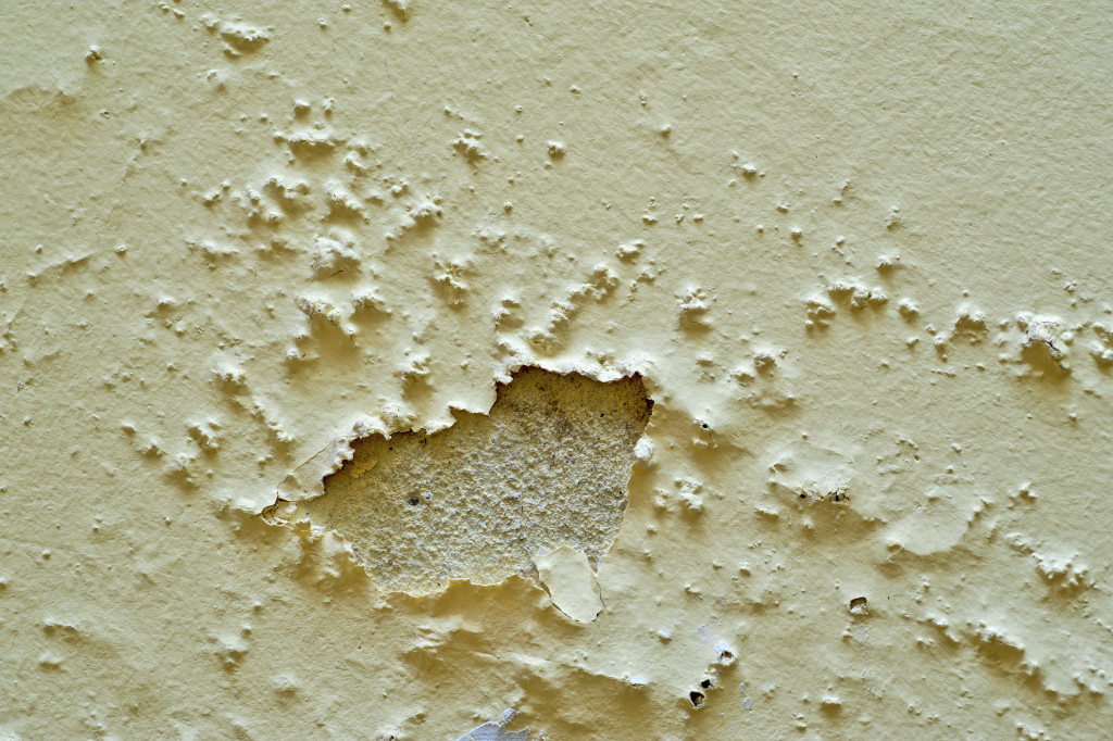 damp wall with flaws concept of corrosion