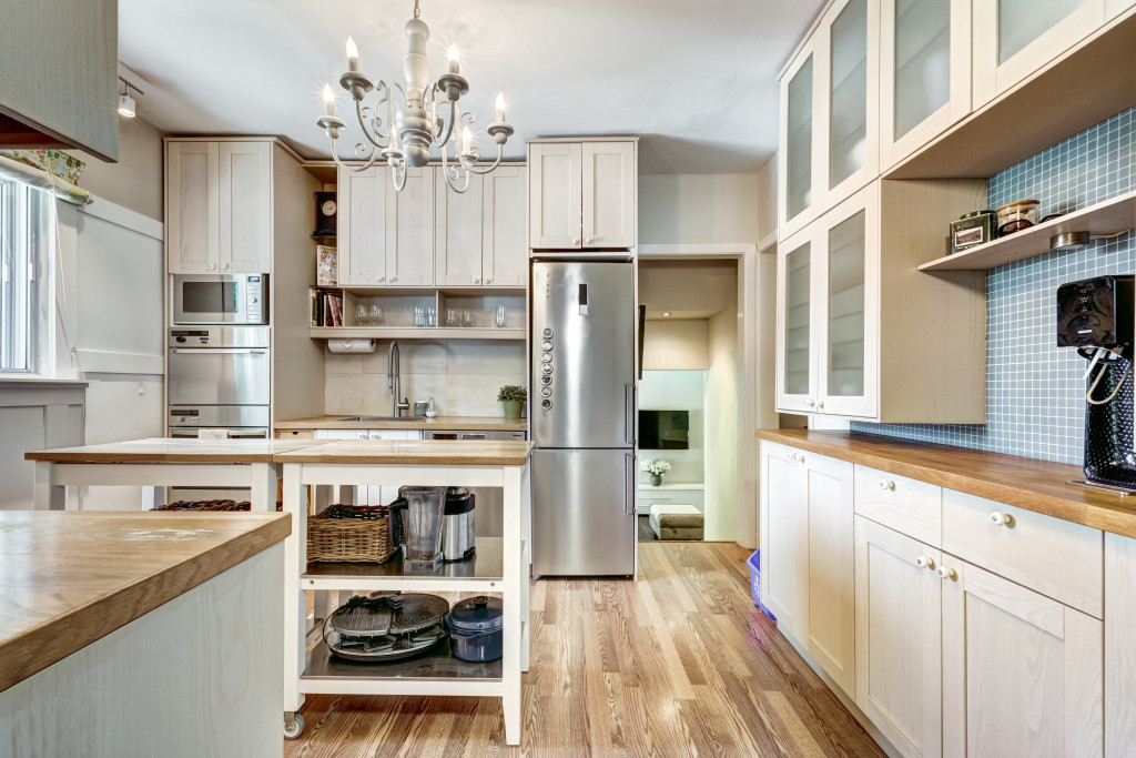 kitchen interior with hardwood flooring and storage cabinets