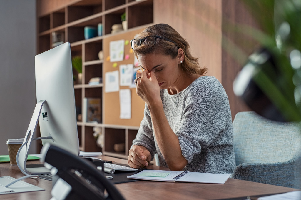 female entrepreneur headache, stress