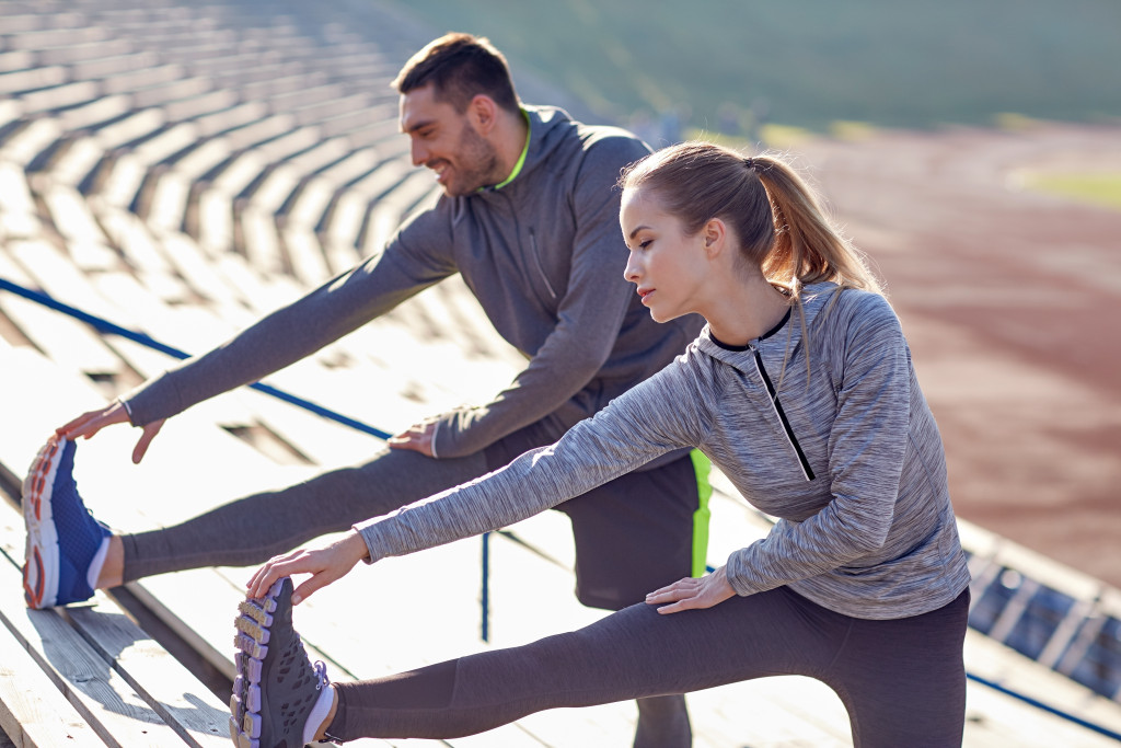 workout buddies stretching for exercise