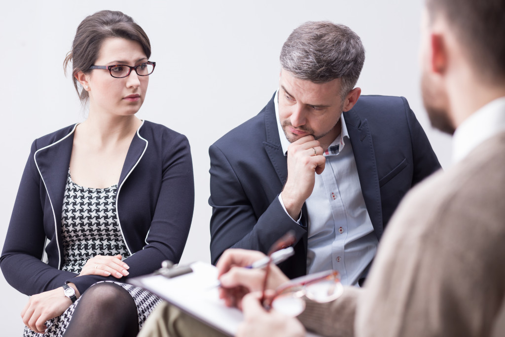 business man and wife in a therapy