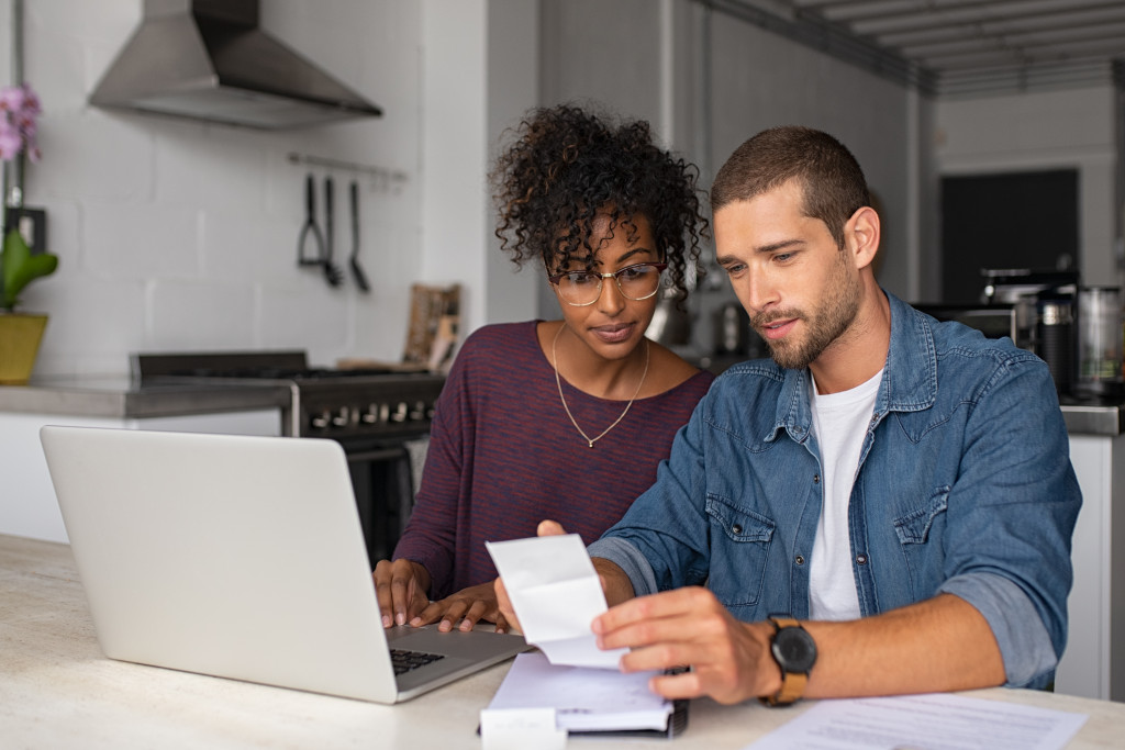 Young couple creating a plan for a home-based business.