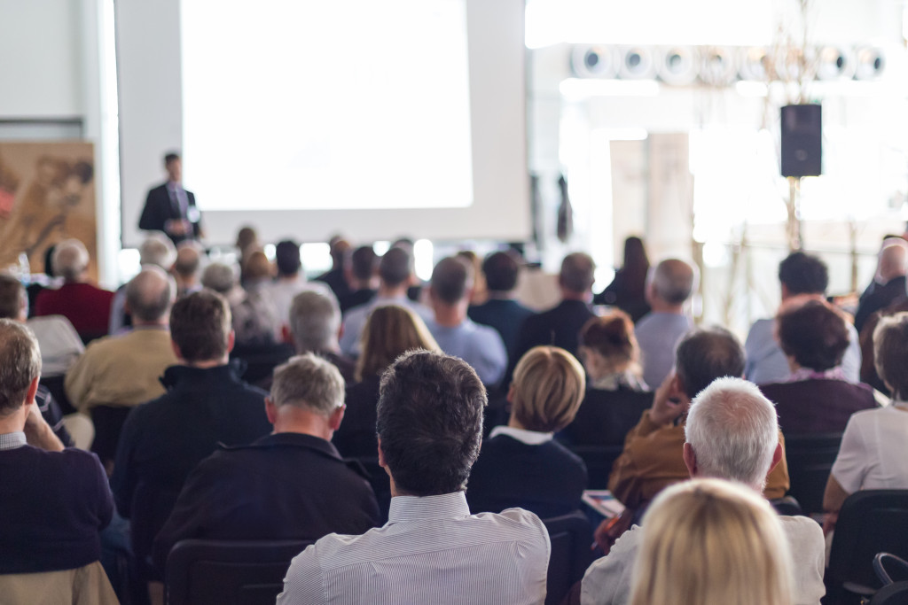 People in a conference hall during business talk