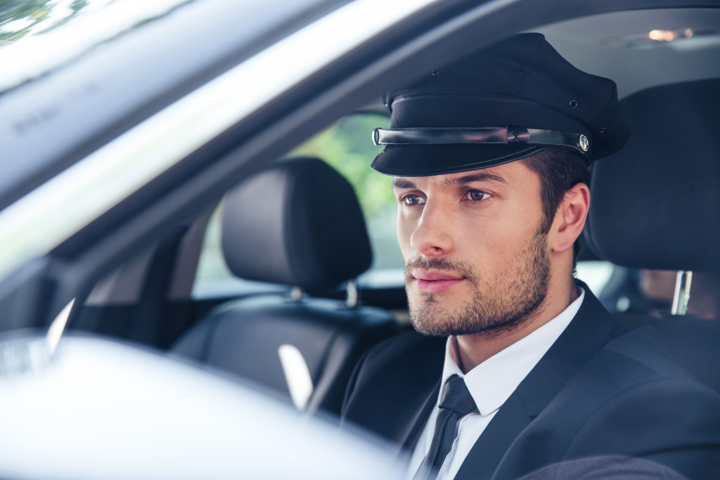 handsome driver for VIP car in uniform