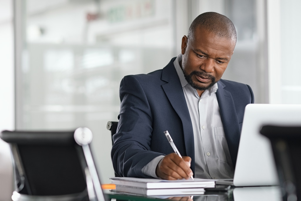 a businessman in the office writing