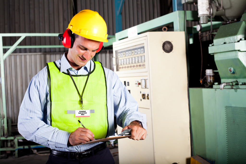 male electricity inspector checking the premises