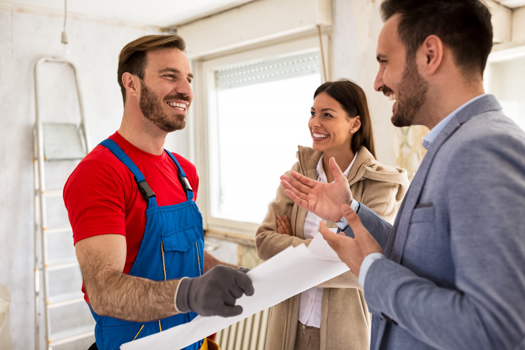 happy clients talking to their contractor